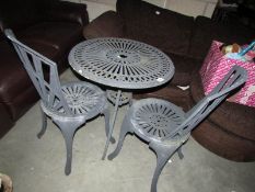 A garden table and 2 chairs