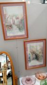 A pair of framed and glazed continental scene prints