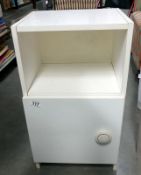 A white bedside cabinet