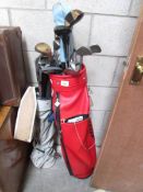 2 golf bags and clubs