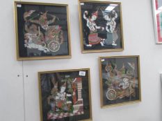 A set of 4 framed and glazed Thai silk pictures