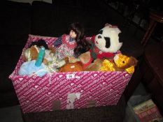 A box of soft toys and dolls