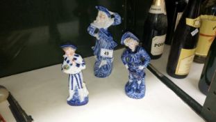 3 blue and white figures