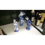 3 blue and white figures