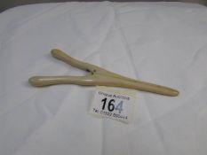 A pair of ivory glove stretchers