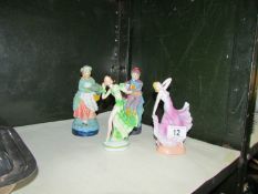 A pair of porcelain figures and 2 others