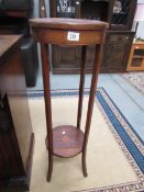 A mahogany inlaid plant stand