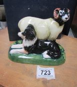 A boxed Moorcroft figure of a border collie dog with a ram