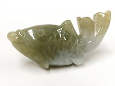 A Chinese grade A apple green jadeite jade fish motif pendant. 21,34 grams, 51.2 x 21.8 x 12.