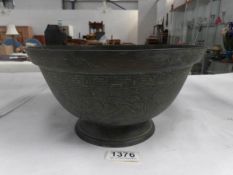 A large oriental bronze bowl