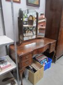 A triple mirror dressing table on Queen Anne style legs