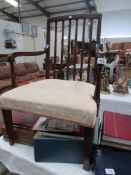 An Edwardian mahogany elbow chair