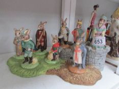 8 Royal Doulton Robin Hood Bunnikin figures on stand