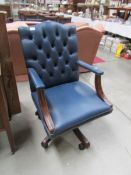 A blue leather executive chair