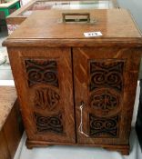 An 1889 collector's cabinet of 12 drawers with some bus tickets and with key