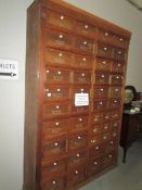 A large bank of drawers from a shop or store,