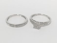 2 white gold and diamond rings being engagement and eternity,