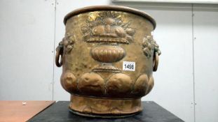 A decorative brass log bin (holes in bottom)