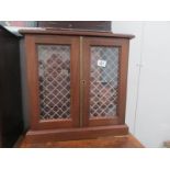 A 2 door coin cabinet with 33 drawers and compartment