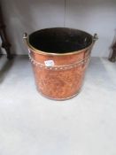 A copper log bin