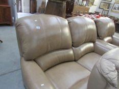 A 2 seat leather sofa and matching chair