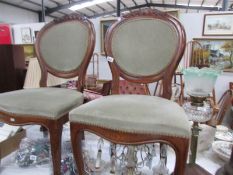 A pair of mahogany balloon back chairs