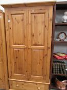A pine 2 door single drawer wardrobe