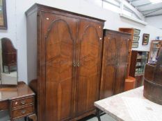 A large mahogany wardrobe and a small matching wardrobe