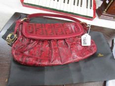 A Fendi handbag with cover
