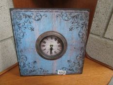 A metal shabby chic table clock