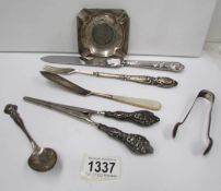A mixed lot including silver sugar nips, silver handled glove stretcher,