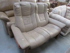 A 2 seat leather relining sofa