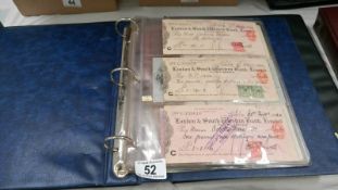 A folder of old cheques, bonds, ration books,