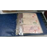 A folder of old cheques, bonds, ration books,