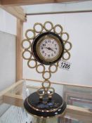 An enamel and brass clock marked Europa, 2 jewel,