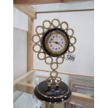 An enamel and brass clock marked Europa, 2 jewel,