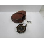 A first world war compass and case marked M.I.O.