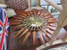 A paico mechanical wind up sunburst clock