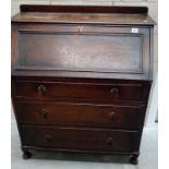 A 1950's solid oak bureau