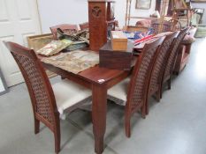 A modern dining table and 8 chairs