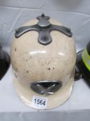 An old fireman's helmet marked Falck on sides