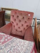 A pink arm chair