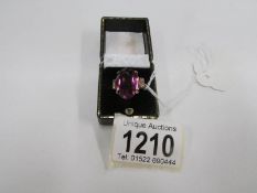 A large amethyst dress ring,