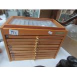 A pen/watch collector's cabinet with drawers
