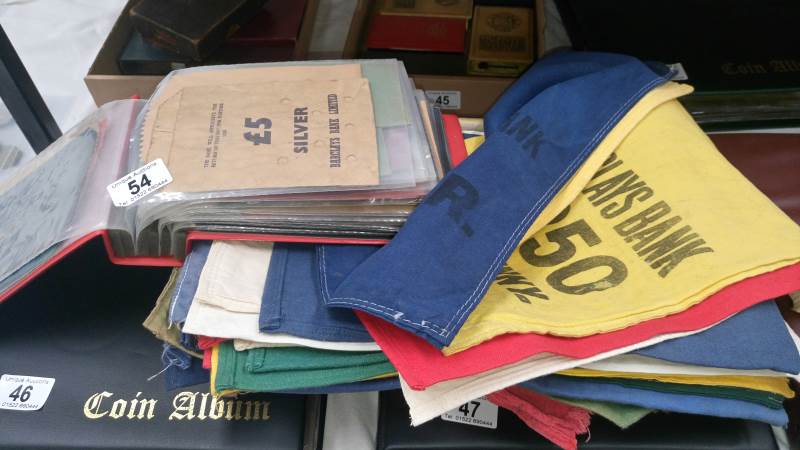 A quantity of old paper and cloth money bags