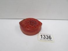 A red jade trinket pot