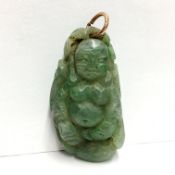 A Chinese Buddha motif gemstone on a pendant, apple green grossular garnet, circa 19th century, 26.
