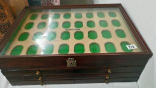 A collector's cabinet with 4 drawers and 2 trays