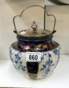 A fine Royal Doulton biscuit barrel with silver plated lid and handle