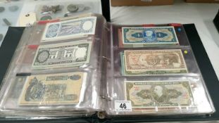 A folder of approximately 120 World bank notes,